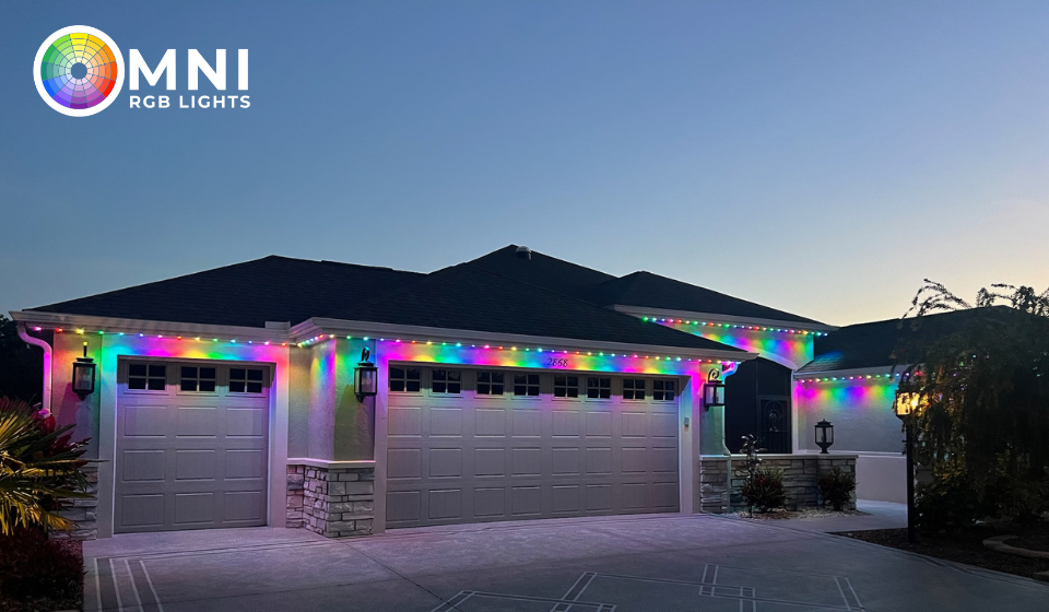 Permanent Christmas lights illuminating a house with festive red and green colors