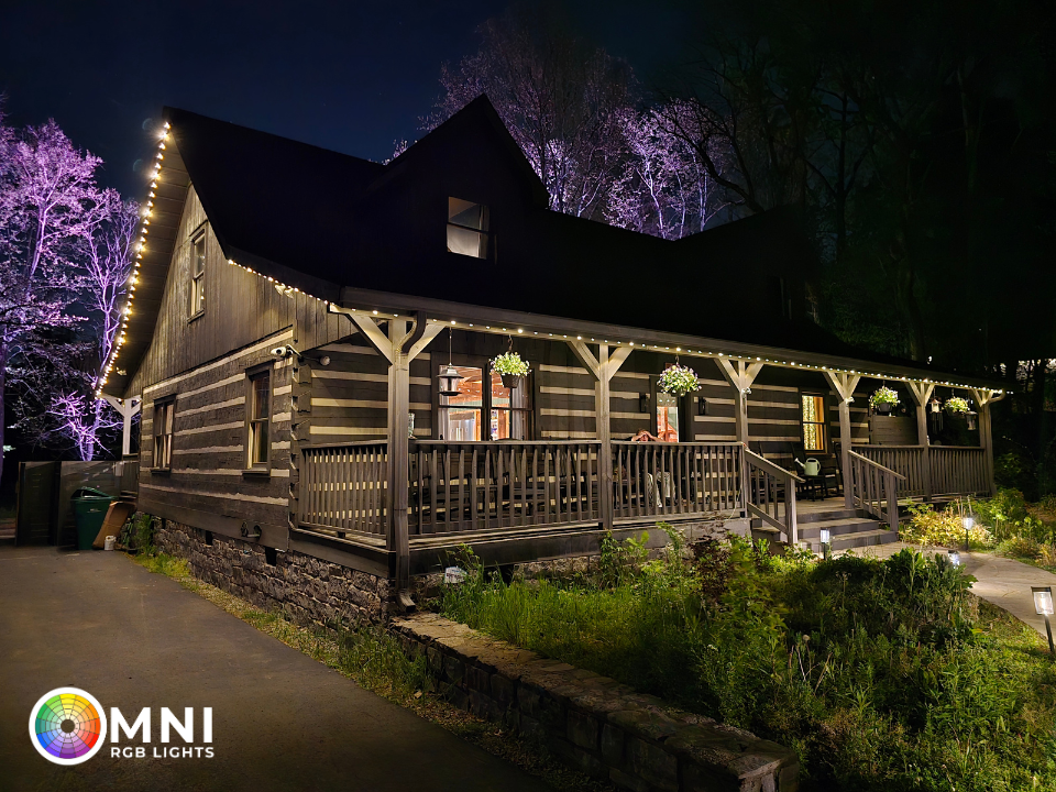 Elegant warm white architectural lighting accentuating the rooflines of a residential home